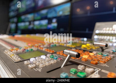 Professional broadcast video switcher used during live television productions, shallow depth of field. Stock Photo