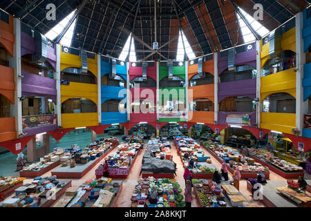 A wide angle view of the colorful central atrium at the big, local food and clothing market. In Kota Bharu, Kelantan, Malaysia. Stock Photo