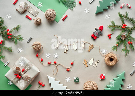 Zero waste Christmas, concept flat layout on rustic wood. Hand crafted gifts, natural Christmas decorations from biodegradable materials, plastic free Stock Photo