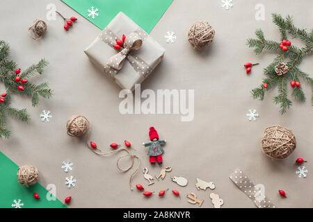 Flat lay, top view on craft paper background..Zero waste Christmas, concept flat layout on rustic wood. Hand crafted gifts, natural Christmas decorati Stock Photo