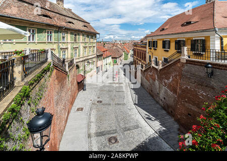Street in the medieval Sibiu old town in Transylvania, a cultural heart of Romania in Eastern Europe Stock Photo