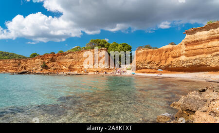 Ibiza, Sa Caleta beach, seascape, beautiful red cliffs Stock Photo