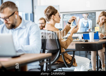Group of creative people working on web design with computers in the office Stock Photo