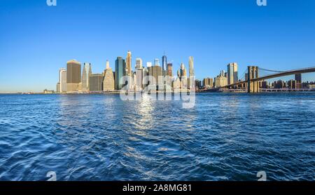 View from Pier 1 over the East River to the skyline of Manhattan, Manhattan Bridge, Dumbo, Downtown Brooklyn, Brooklyn, New York Stock Photo