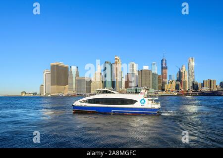 Ferry, NYC Ferry on the East River, view from Pier 1 to the skyline of Manhattan, Dumbo, Downtown Brooklyn, Brooklyn, New York Stock Photo