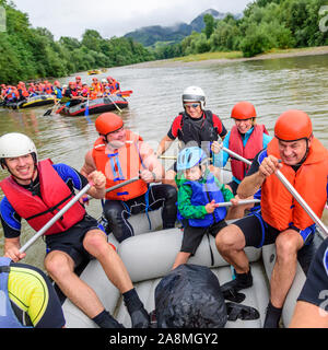 River rafting with families and children on the river Iller in the Allgäu alps Stock Photo