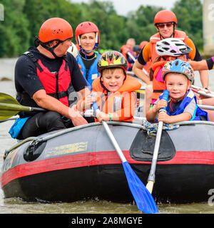 River rafting with families and children on the river Iller in the Allgäu alps Stock Photo