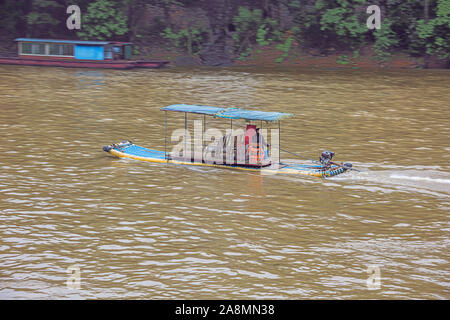 Editorial: GUILIN, GUANGXI, CHINA, April 19, 2019 - Small motorized boat passing by on the Li River near Guilin Stock Photo