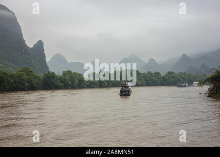 Editorial: GUILIN, GUANGXI, CHINA, April 19, 2019 - View of distant misty hills on the Li River near Guilin Stock Photo