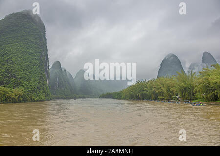 Editorial: GUILIN, GUANGXI, CHINA, April 19, 2019 - Passing Xingpingzhen fishing village on the Li River in the vicinity of Yangshuo near Guilin Stock Photo