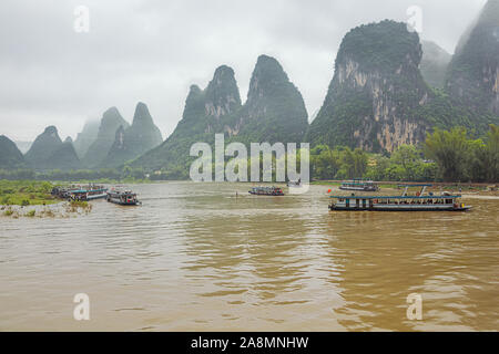 Editorial: GUILIN, GUANGXI, CHINA, April 19, 2019 - Busy boat traffic at Maozhou island in the vicinity of Lingchuan near Guilin Stock Photo