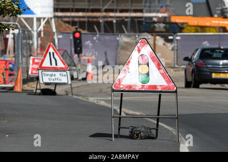 temporary traffic lights at a roadworks site england Stock Photo - Alamy