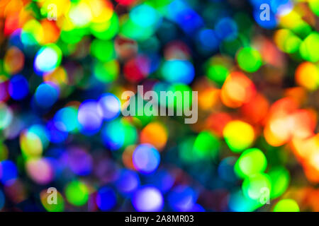 Blurred defocused multi color lights as Christmas decorations background. Party concept. Stock Photo
