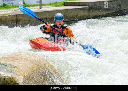 Kayaking on an artificial wild water channel Stock Photo