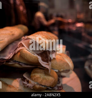 BOCADILLO - VIANDAS DE LA SALAMANCA - JAMONES Y EMBUTIDOS - SPANISH HAM SANDWICH DISPLAYED IN A SHOP WINDOW - SPANISH DELICATESSEN - PAMPLONA SPAIN © Frédéric BEAUMONT Stock Photo