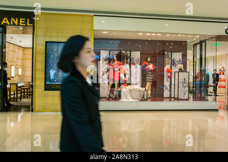 Shanghai, China, Woman in Luxury Chinese Shopping in Modern Commecial Center, Heng Long Plaza, Chanel Shop Front, clothing store women wealthy walking, Prestige consumer Stock Photo