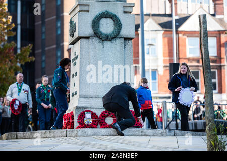 Veterans and civilians lay reefs and notes of condolence to the fallen at the Remembrance Day, armistice day parade in the city centre Stock Photo