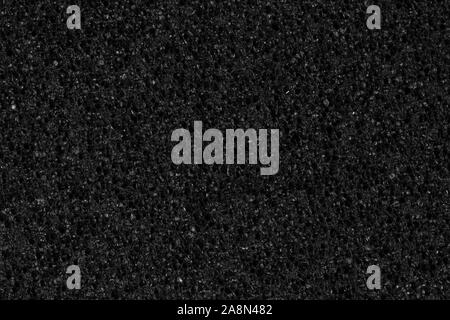 Dark grey, black foam, EVA texture with contrast relief surface. Stock Photo