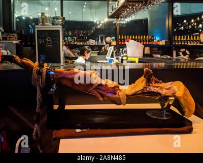 SEPT. 13, 2019-BUSAN SOUTH KOREA : Display of the pork leg in front of a wine bar. Stock Photo