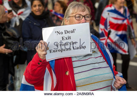 London, UK. 31st Oct, 2019. A woman holds up a sign at A Leave means Leave march at Westminster, held to protest the failure to deliver Brexit.