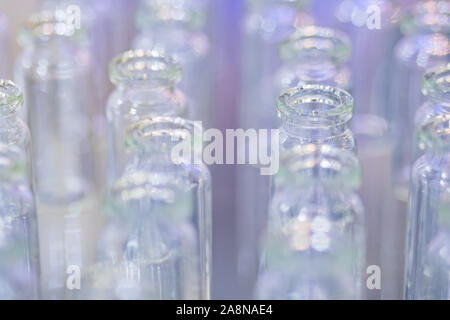 Medical empty glass bottles in showcase at pharmaceutical exhibition Stock Photo