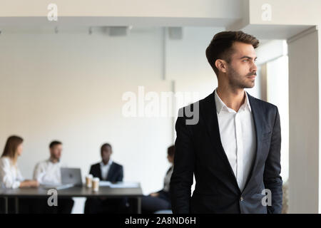 Serious Caucasian businessman look in distance thinking of success Stock Photo