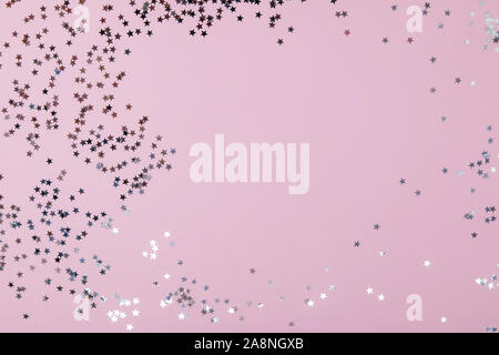 Festive backdrop with star shaped confetti Stock Photo