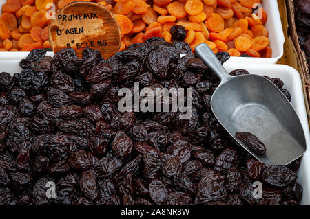 dried  prunes on french market stall, with apricots in background.provence France.healthy living. Stock Photo