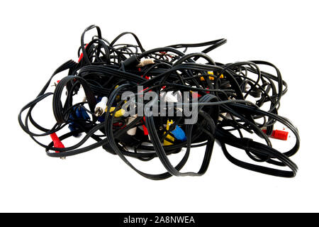 Messy tangle of wires for video on a white background isolated, bundle of audio video electrical leads. Stock Photo