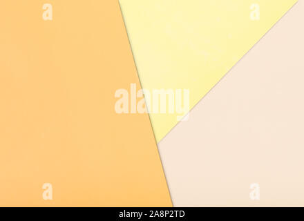 Paper color background. Three warm soft pastel color yellow, light brown and pink Stock Photo