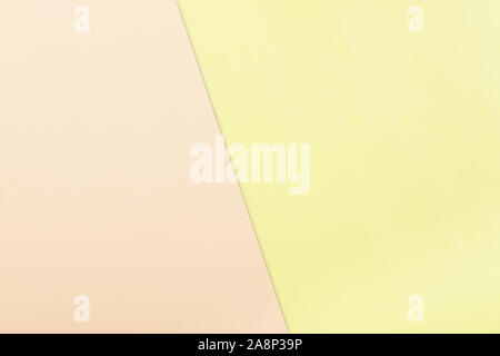 Color paper  background. Two pastel tone - pink and yellow, divided shadow line Stock Photo