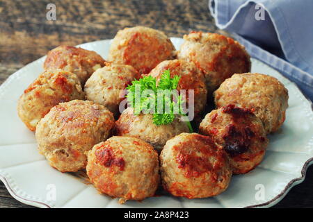 Fried meat ball, delicious meat cutlets on rustic dark table Stock Photo