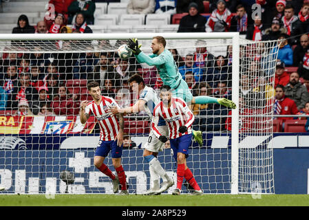 10th November 2019; Wanda Metropolitano Stadium, Madrid, Spain; La Liga Football, Atletico de Madrid versus Espanyol; Jan Oblak (Atletico de Madrid) comes out to collect the cross but falls awkwardly and drops the ball - Editorial Use Stock Photo