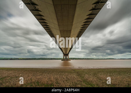 Grey clouds over the Humber Bridge, seen from Barton-Upon-Humber in North Lincolnshire, England, UK Stock Photo