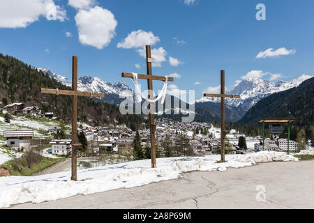 Wooden crosses near the church of Our Lady Immaculate in Falcade, Dolomites, Veneto, Italy Stock Photo