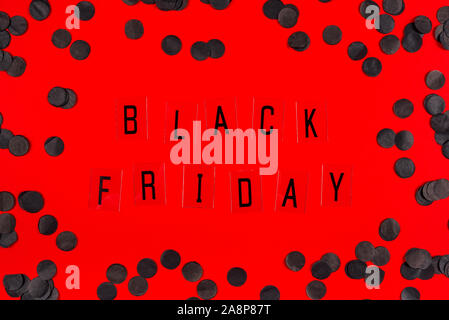 Black Friday sale tag on red background. Stock Photo