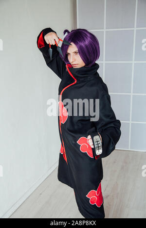 woman anime cosplayer with purple japan hair Stock Photo - Alamy