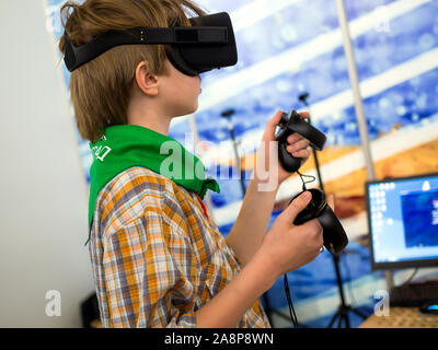 Voronezh, Russia -  June 05, 2019: Using virtual reality accessories in computer games Stock Photo
