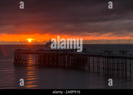 Sunrise over the Victorian pier at Llandudno on the North Wales coast Stock Photo