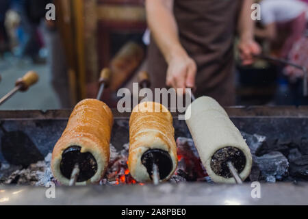 Preparation of the famous, traditional and delicious Hungarian Chimney Cake Stock Photo