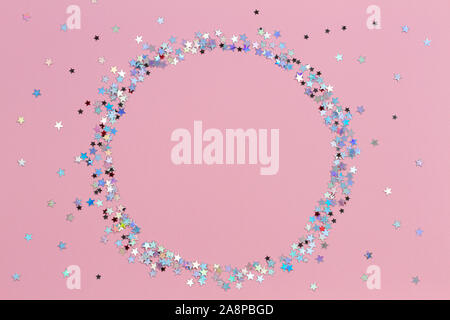 Circle glitter star decoration christmas happy new year frame on pink background with empty copy space Stock Photo