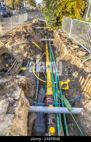 Neat orderly organised cables, pipes and sewage under pedestrian walkway during renovation of the infrastructure system. Netherlands Stock Photo