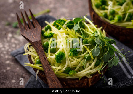 Zucchini pasta with green peas Stock Photo