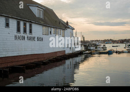 Old warehouse now being used for different shops along Gloucester Harbor. Gloucester is the oldest seaport in America. Fishing industry still thrives. Stock Photo