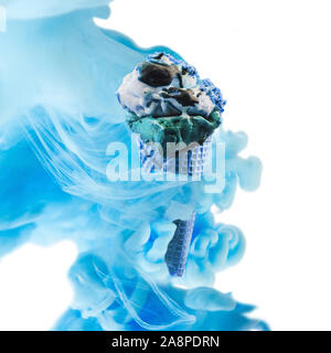 Creative ice cream with zero gravity. Ink in water style. Stock Photo