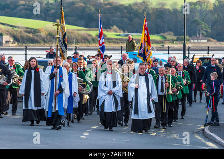 Appledore, North Devon, UK. Sunday 10th November 2019. UK Weather. Sunshine and a gentle breeze on Remembrance Sunday in North Devon. The community gathers as wreaths are laid on the Appledore village war memorial on Remembrance Sunday. Terry Mathews/Alamy Live News. Stock Photo