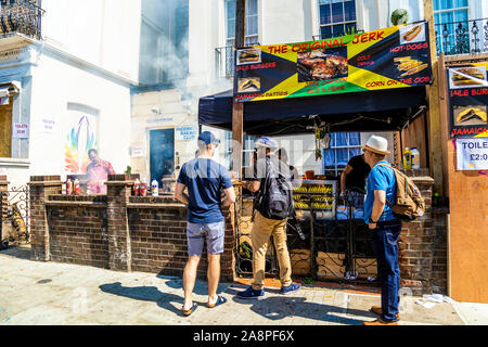 Makeshift food stall with Jamaican jerk chicken during the Notting Hill Carnival 2019, London, UK Stock Photo