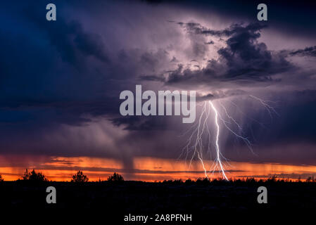 Lightning storm at sunset, Southeast Oregon. Stock Photo
