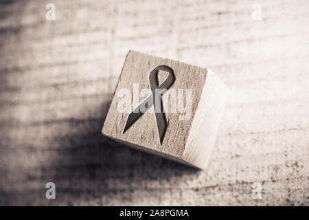 Black Death And RIP Ribbon On Wooden Block On A Table Stock Photo