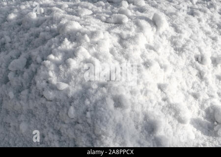 The texture of pure white snow close-up. White real snow background. Stock Photo